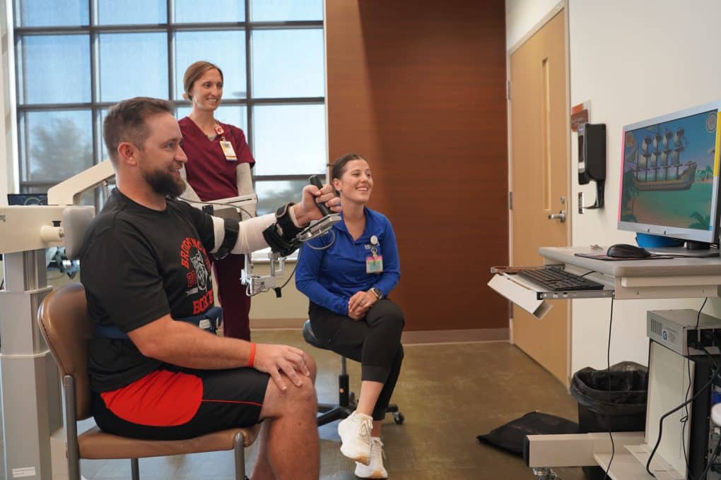 Team effort helps football coach tackle stroke recovery