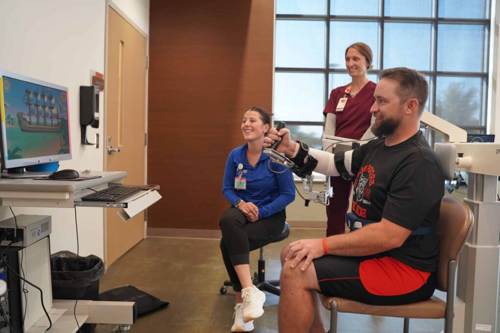 Team effort helps football coach tackle stroke recovery