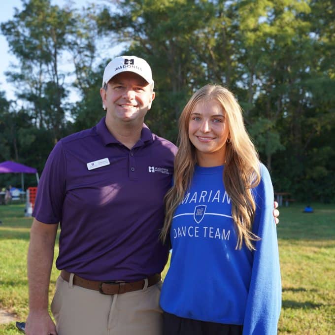 Girl poses with her father