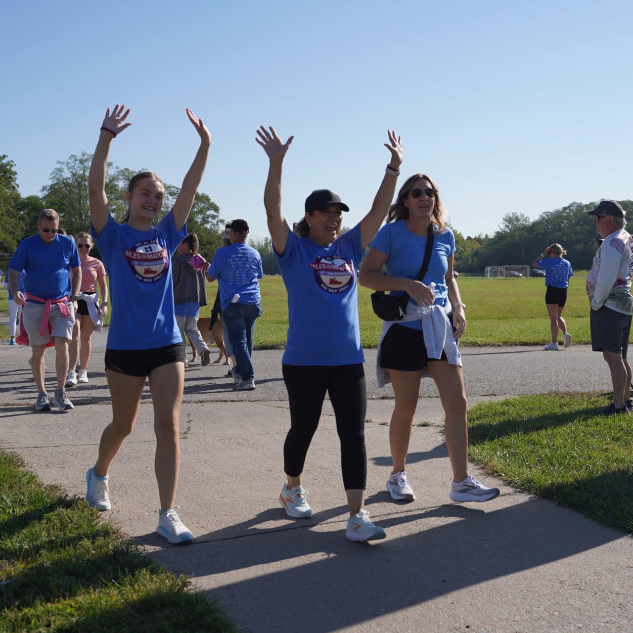 A group of women cross the finish line