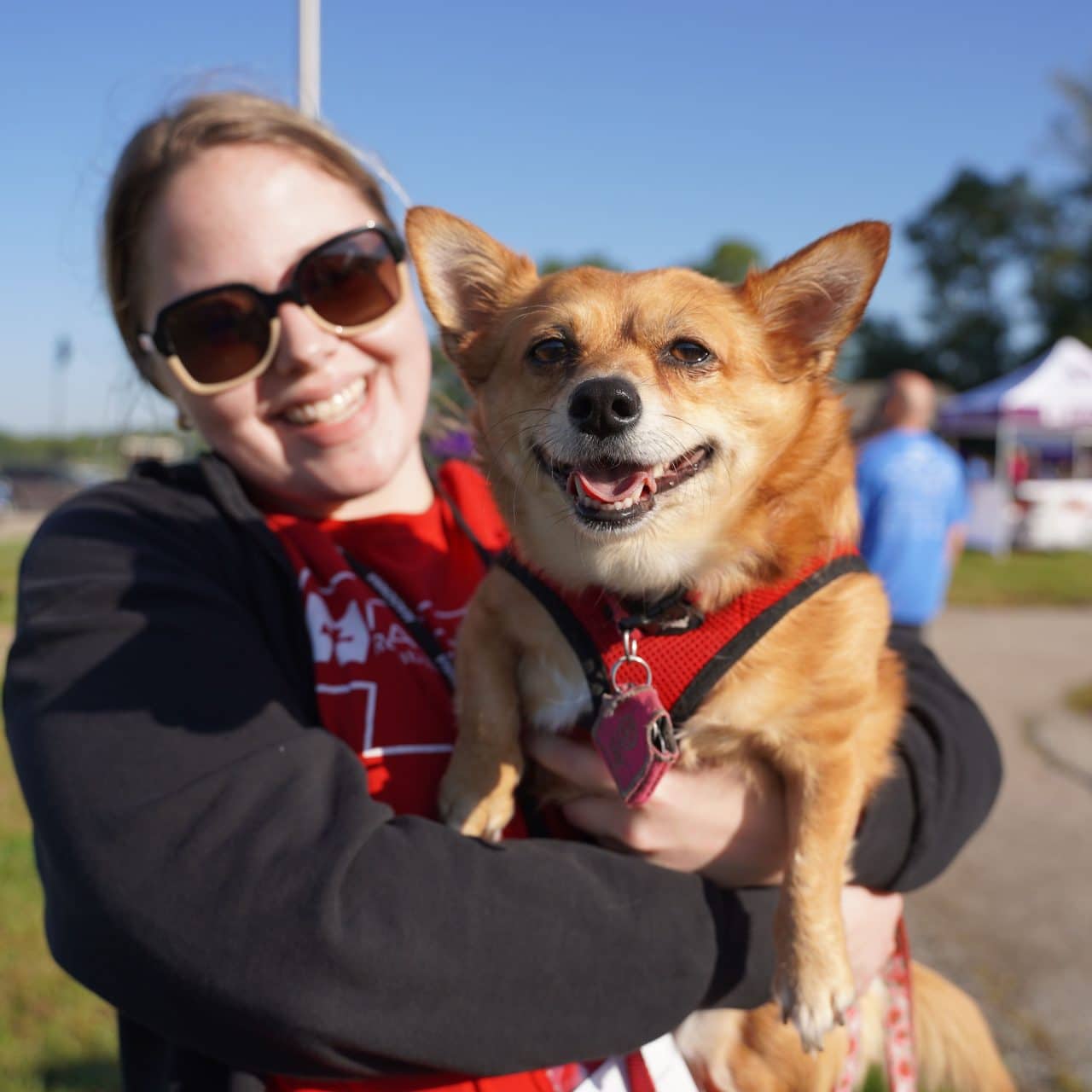 Sally, a Madonna employee attending the event her smiling corgi up to the camera