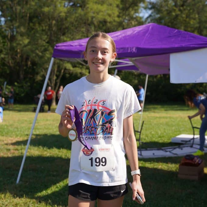 5k winner smiles at camera